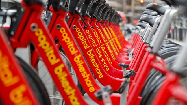 Red bicycles from Capital Bikeshare are seen docked in downtown Washington, Wednesday, Feb. 14, 2018. (AP Photo/Pablo Martinez Monsivais)