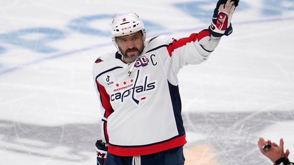 Washington Capitals' Alex Ovechkin acknowledges fans during a scoreboard tribute during the first period of an NHL hockey game against the Pittsburgh Penguins in Pittsburgh, Thursday, April 17, 2025. (AP Photo/Gene J. Puskar)
